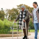 Caregiver walking a senior outside