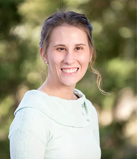 a woman smiling at the camera